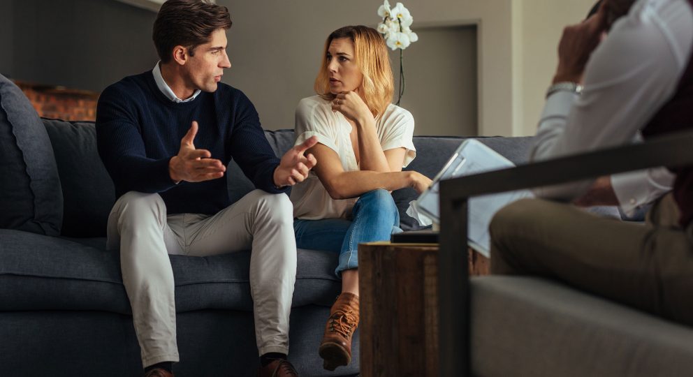 The Research: Predicting Divorce from an Oral History Interview. Image of couple talking earnestly.