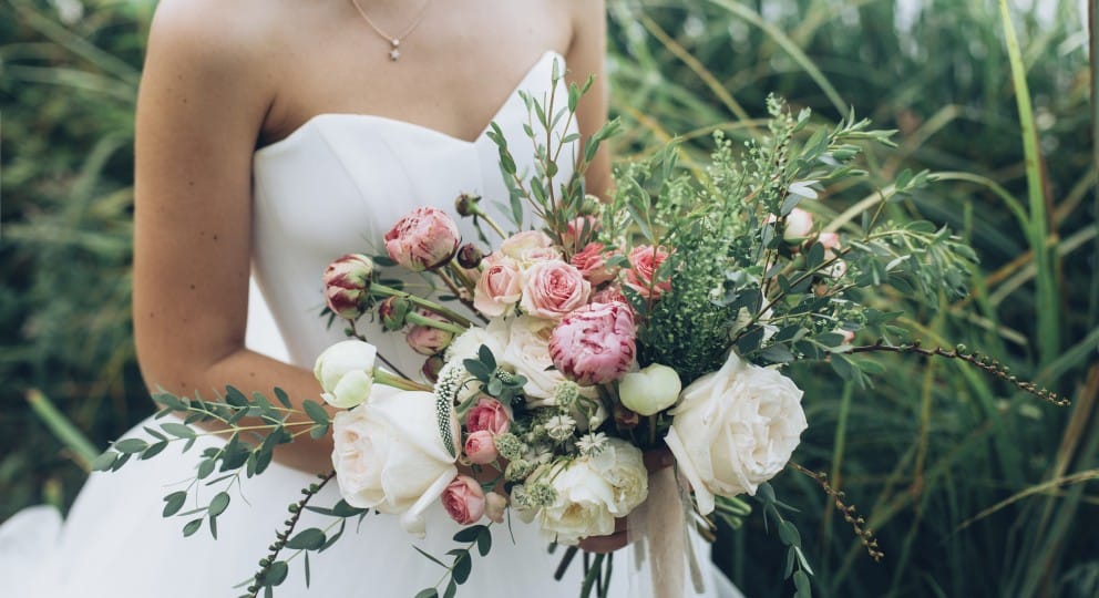 Picture of a bride holding a bouquet on the topic of timing in seeking marriage counseling