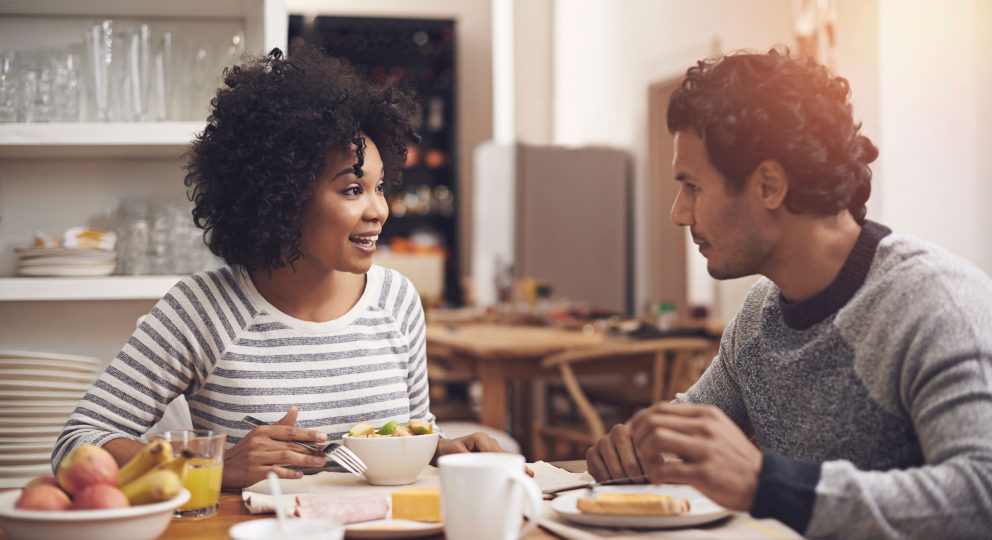 How to be kind when you are upset with your partner. Image of couple talking.