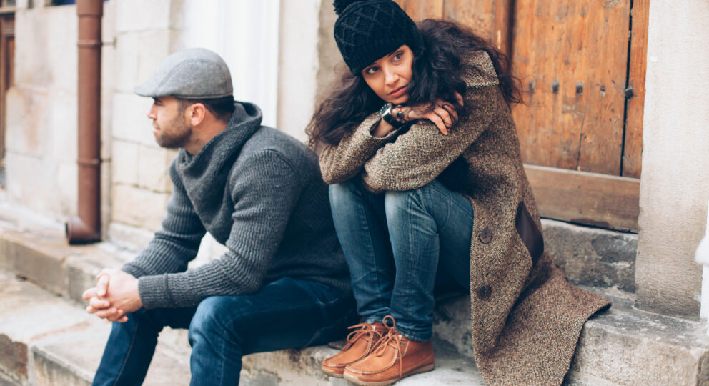 4 negative behaviors that may be making you sick. Image of couple looking away from one another.