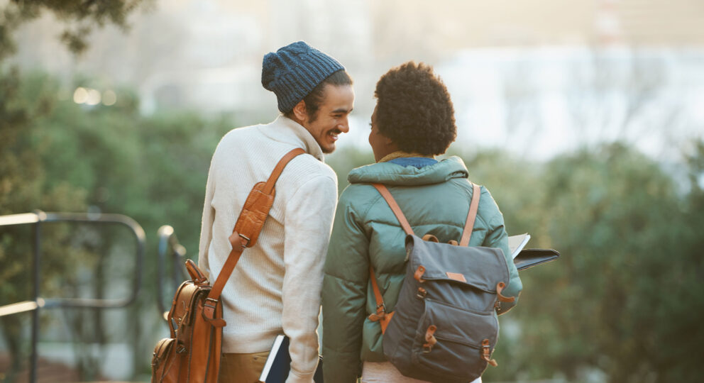 image of couple talking and smiling while looking a nice view together