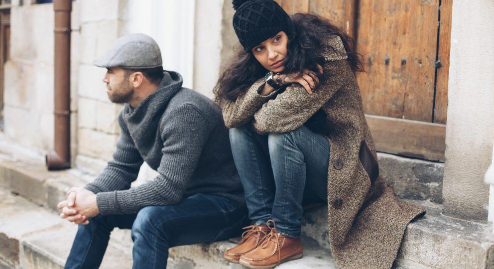 is it time for couples counseling? Picture of couple not looking at each other.