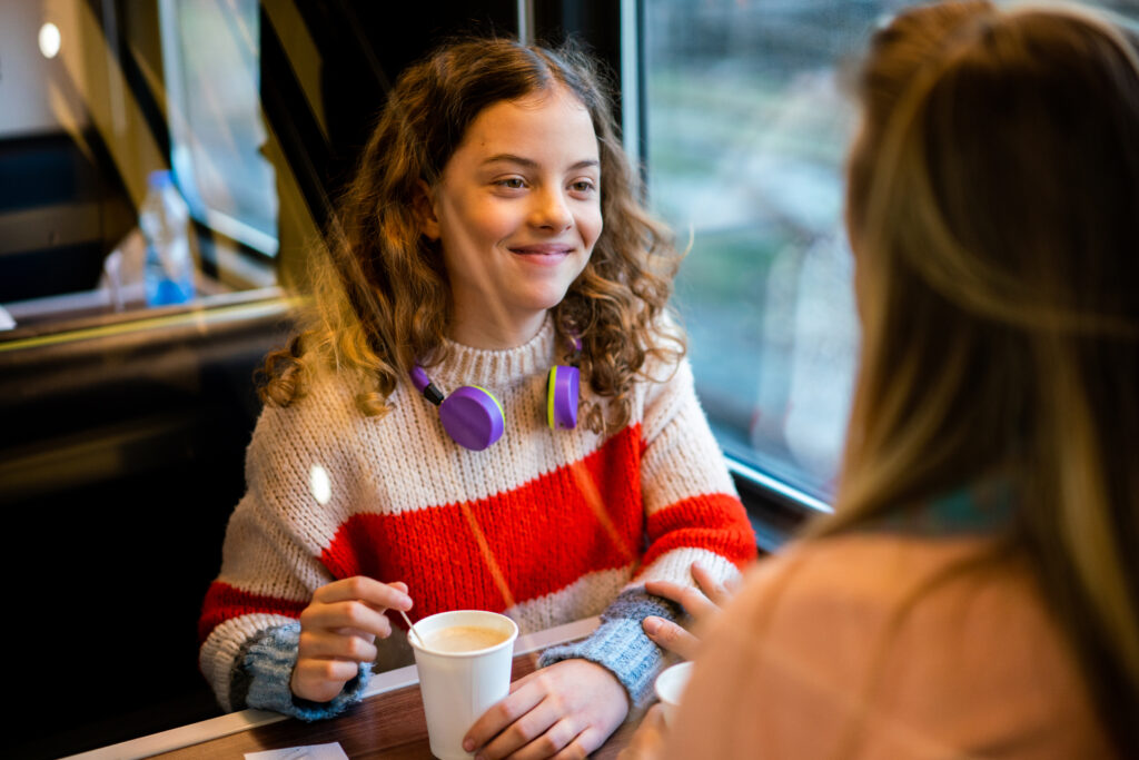 Parent talking to her young teen daughter