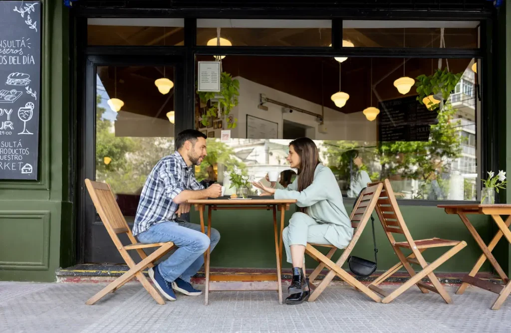 Couple enjoying a quiet coffee date but do they look like and introvert dating extrovert?