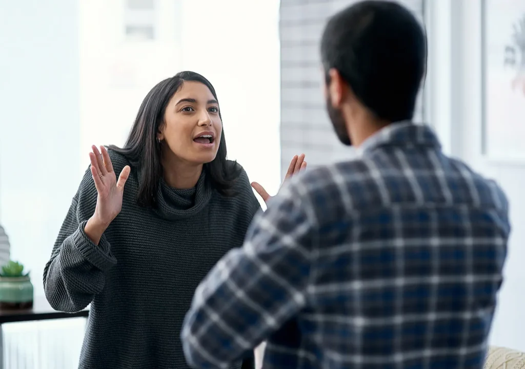 A woman is arguing with her partner. Couples argue for many common reasons.