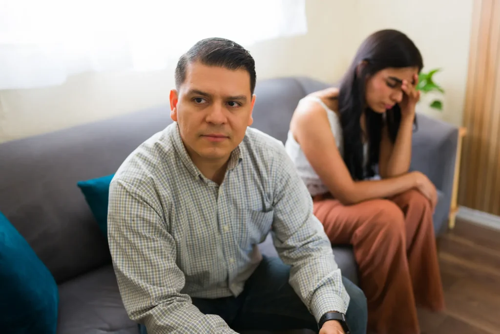 Couple sitting together unhappy considering a divorce.