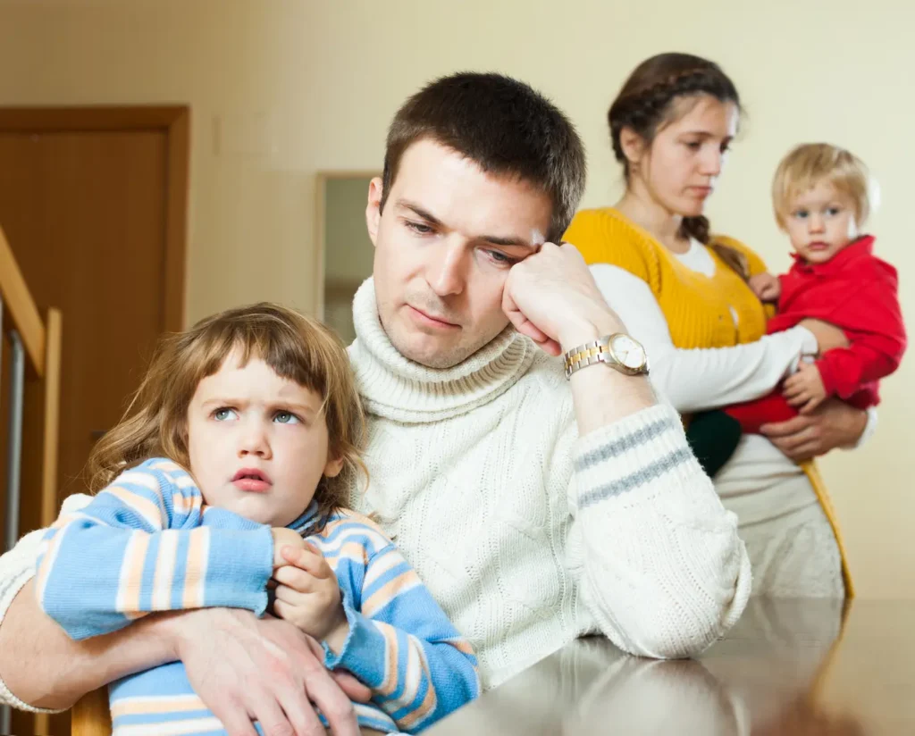 A couple with kids emotionally disconnected from one another.