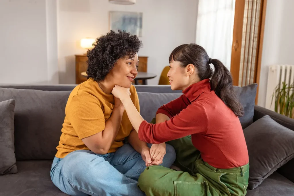 A couple engaged in healthy communication deepening their connection using Gottman strategies.